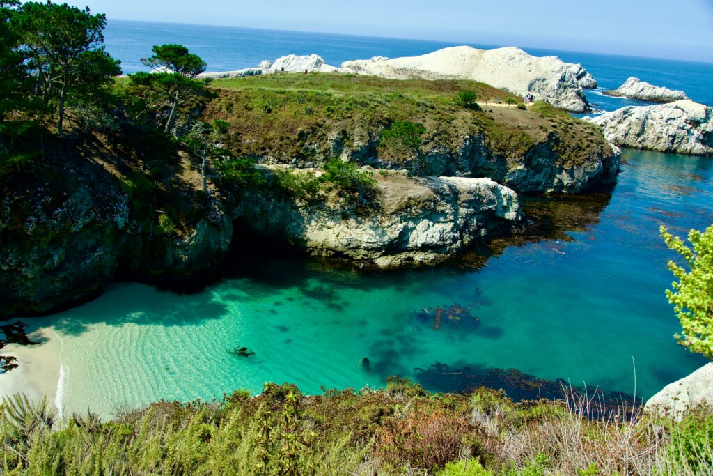 Family hiking the coastal trails at Point Lobos State Natural Reserve near Carmel, California